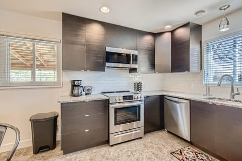 Fully stocked and updated kitchen (pots, pans, cooking utensils) with granite