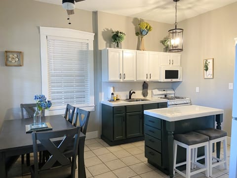 View of kitchen from bottom of stairs