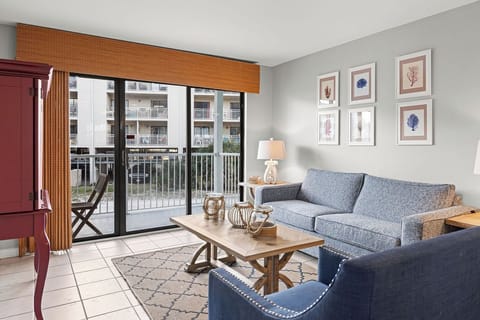 Welcome to Romar Beach Unit 112 - This cozy, 2 bedroom, 2 bathroom unit features a side view of the beach, but is a great unit for your next vacation destination. Only a short elevator ride to sticking your toes in the sand!!!