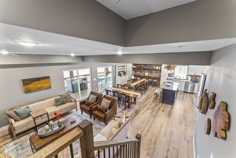 Full View from Stairs into Main Living Common Area and Porch Access