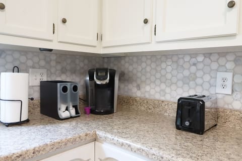 There is a Keurig coffee maker with complimentary coffee.