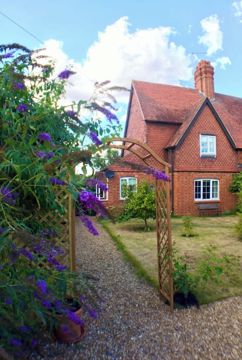 Charming Bay Tree Cottage built in 1895 with unusual tiled features.