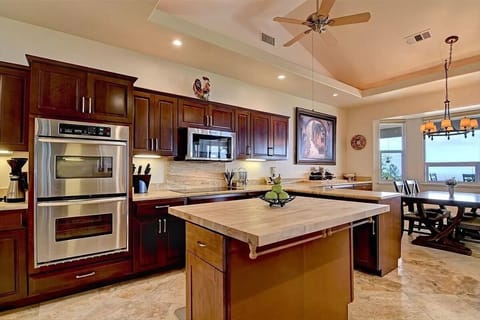 Large kitchen with Cherry Wood cabinetry and views of the ocean.