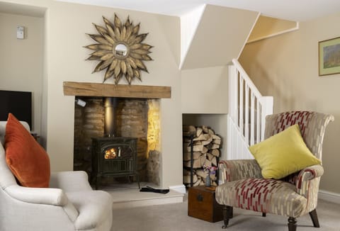 Ground floor:  Settle in by the fireside after a day out exploring the local area