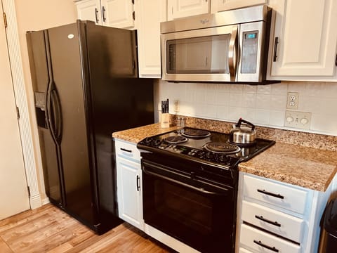 Modern, updated kitchen with all you need (pots, pans, dishwasher, appliances)