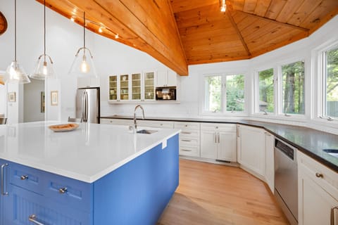 Bay windows in the kitchen flood the space with natural light