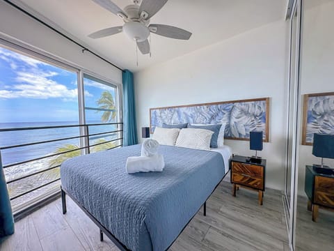 Oceanview Bedroom: Revel in breathtaking sea views from your modern retreat with stylish decor!