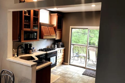 Another view of the kitchen with the deck in back