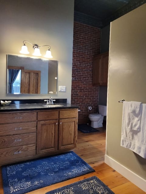 Main Bath with entrance from Bedroom 1 and hallway