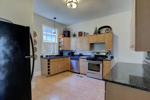 Full kitchen with all your essential needs: basic cookware, olive oil, salt and pepper, oven, microwave, kettle, coffee, and tea.