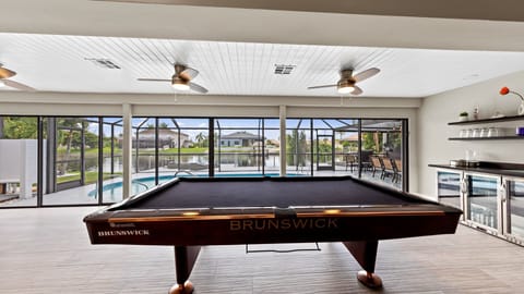Billiard table with view to pool deck
