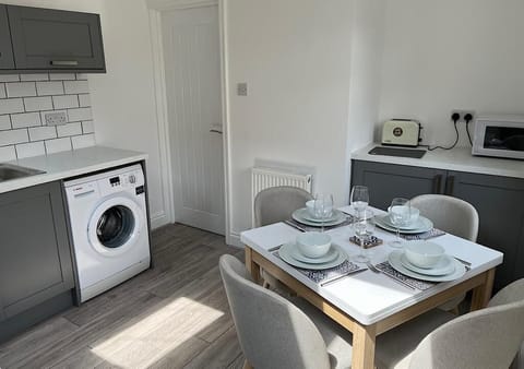 Kitchen and dining table, the table extends out to seat 6 if needed