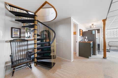 Spiral staircase between main floor and  walkout basement