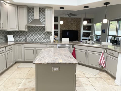 Kitchen flows into family area.