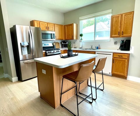 Kitchen island overlooks the pool area, perfect for cooking space!