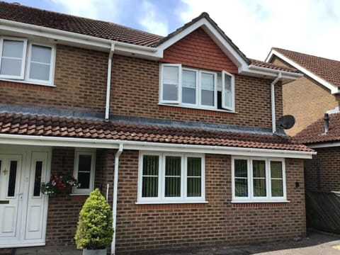 Front of our house showing annexe windows.