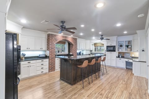 Large open kitchen with desk area for remote work.
