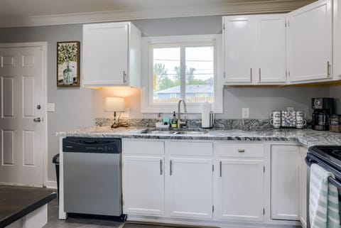 Full kitchen with direct access to a fenced in and well maintained backyard