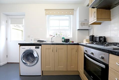 A fully furnished kitchen where you can cook your desired meals during your stay