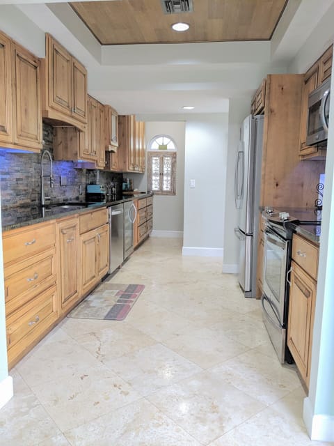 Kitchen with granite and stainless steel appliances 