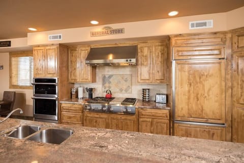 48" range w grill, new steam oven, convection / microwave oven, warming drawer, built-in fridge.