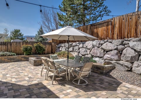 Shaded outdoor dining with cushioned patio seating