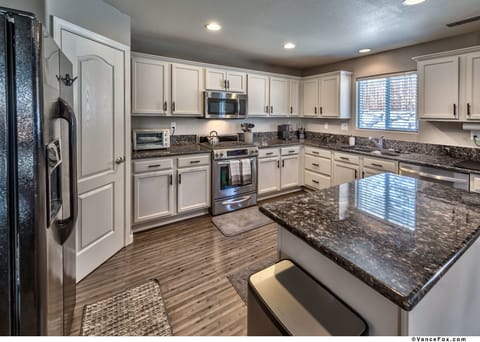 Large, spacious kitchen with plenty of cupboard space and large walk in pantry