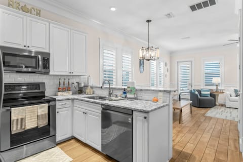 large, updated fully stocked kitchen + coffee bar