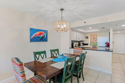 Gather around your coastal dining table where vibrant sea turtle artwork sets the scene for memorable meals together.