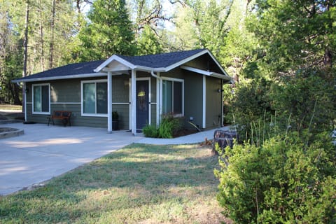 West, front entrance with the sidewalk that leads you around back to the patio.