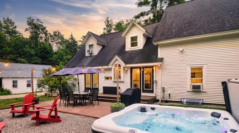 Relax in the hot tub and dine under string lights on this inviting patio