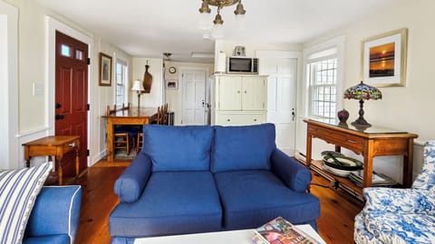 Bright and cozy main living area with living room, dining area and kitchen