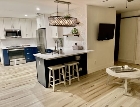 Open kitchen to eat-in bar area.