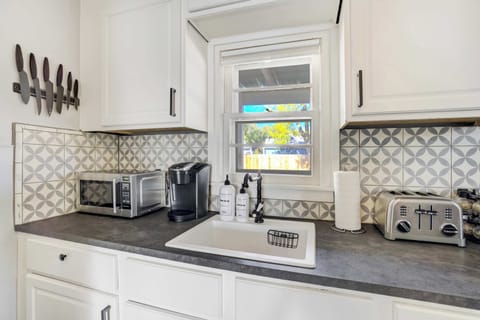 Fully stocked kitchen with a coffee maker, toaster, and all the essentials for easy meals at home.