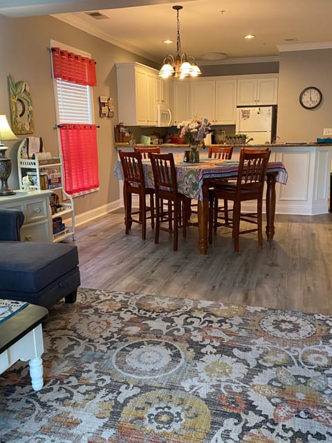 Dinning area with large six chair pub table. It also has a leaf to make It large