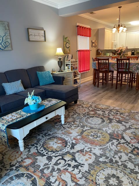 Livingroom and dining area. Bookshelf with games, puzzles & Bose iPhone speaker