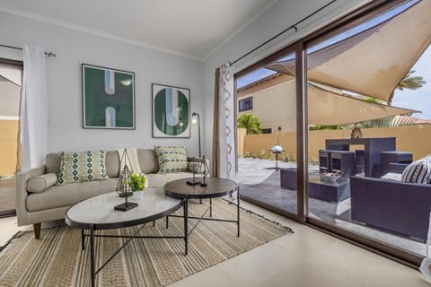 Snug on this sofa in the living room. You can view the outside thru a large sliding door. The curtains add privacy and intimacy during night time.