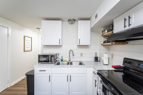 Full-size kitchen with refrigerator, stove/oven, and microwave
