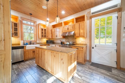 Enter from the front porch and into the gourmet kitchen.