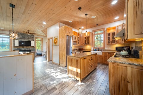 The kitchen has 9 foot custom cabinets hand made by a local artisan.