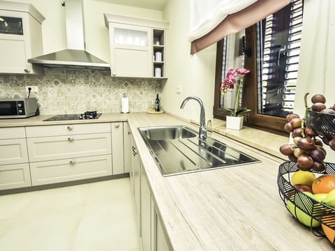 Countertop, Cabinetry, Sink, Property, Kitchen Sink, Tap, Kitchen, Kitchen Stove, Interior Design, Wood