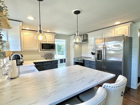 Renovated kitchen with farm sink and stainless steel appliances, SS Cookware and all you need to make a favorite meal for your loved ones. 