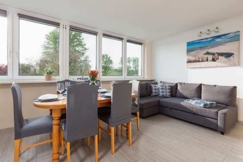 Relax in the stylish living room with a comfortable sofa and modern decor.