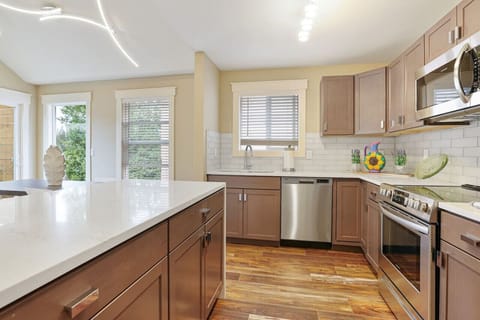 Open modern Kitchen Design.Oversized deck with a view of Star LakeSeattle /Tacoma Area.