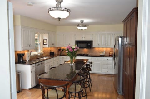 The kitchen island bar has seating for 10 with extra seating on the deck.