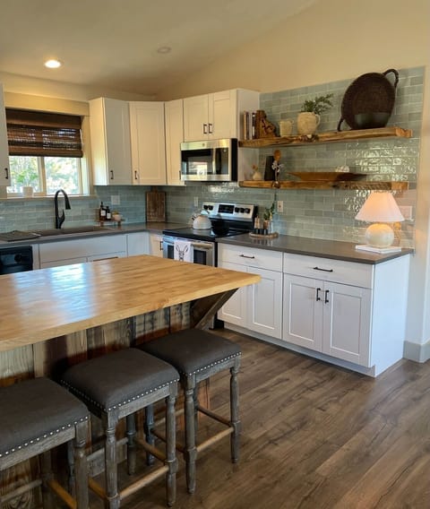 Fully Stocked Open Kitchen & Butcher Block Seating for Four