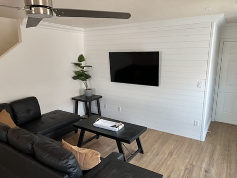 Living Room, Smart TV with Live TV and other streaming programs.