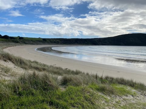 Relax and unwind at the beach, a 5min walk from your back door.