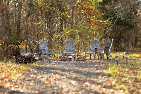 Fire Pit Area.  Chairs include drink holder that swings out under arm rest