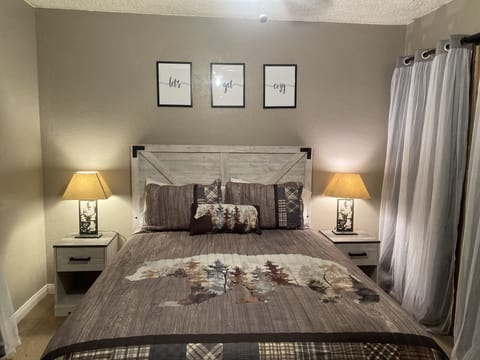 Bedroom 1 located on first floor has one queen bed as well as a smart TV